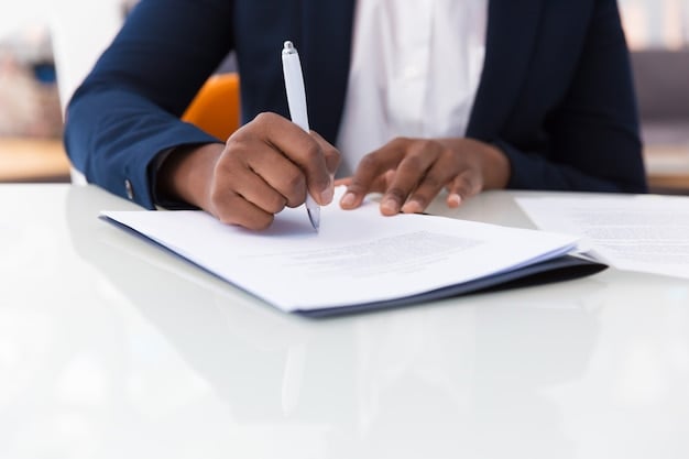 Focused Hand Writing On Document image in article Can a Signing Day Inspire the Next Generation of Early Childhood Teachers in Georgia?